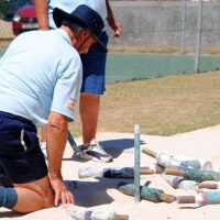 Umpire measuring jukskei pin positions